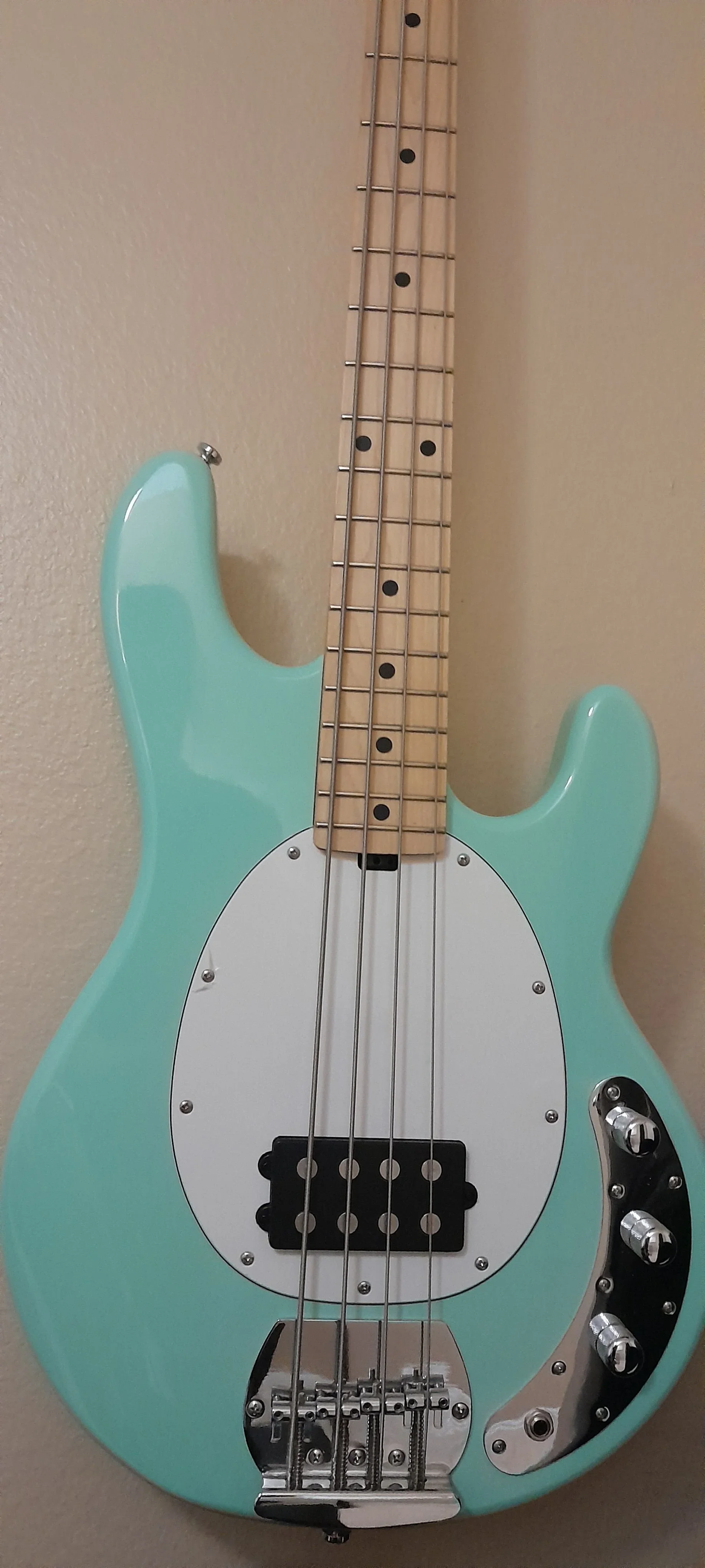 Mint green electric bass guitar